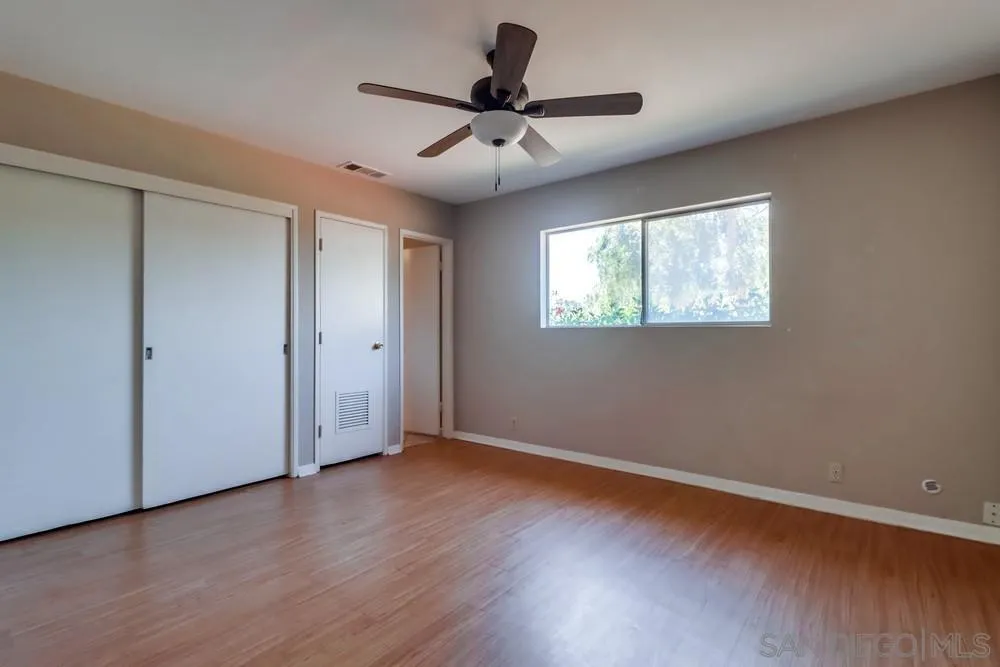 530 Mountain View Road El Cajon, CA 92021 - Photo 11 of 18 a view of an empty room with wooden floor and a window