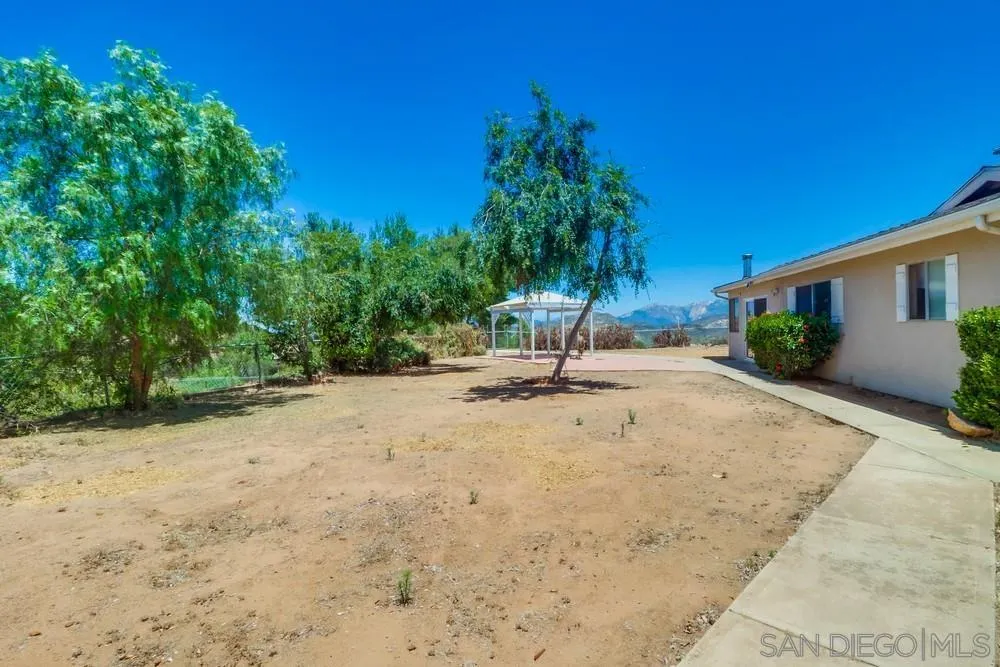 530 Mountain View Road El Cajon, CA 92021 - Photo 15 of 18 a view of a backyard with a tree