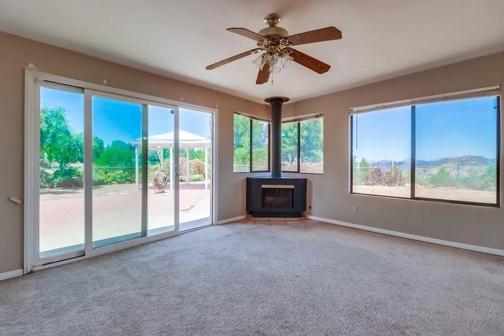 530 Mountain View Road El Cajon, CA 92021 - Photo 8 of 18 a big room with windows and a ceiling fan