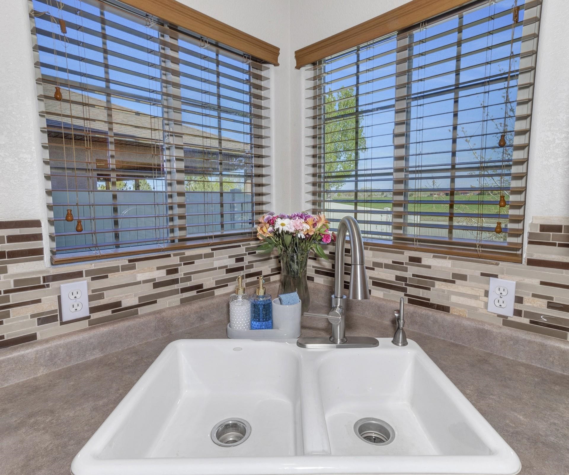2432 Jack Creek Road Grand Junction, CO 81505 - Photo 12 of 26 a bathroom with a tub and a sink