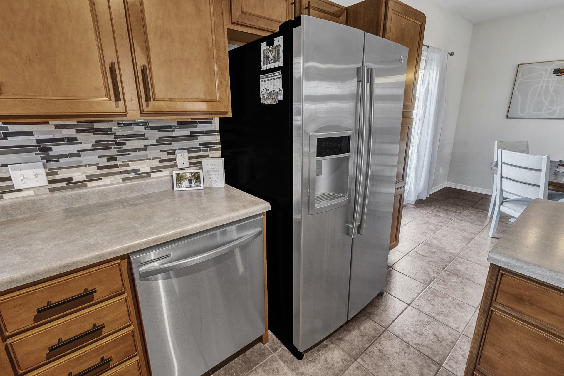 2432 Jack Creek Road Grand Junction, CO 81505 - Photo 14 of 26 a kitchen with a refrigerator and a sink
