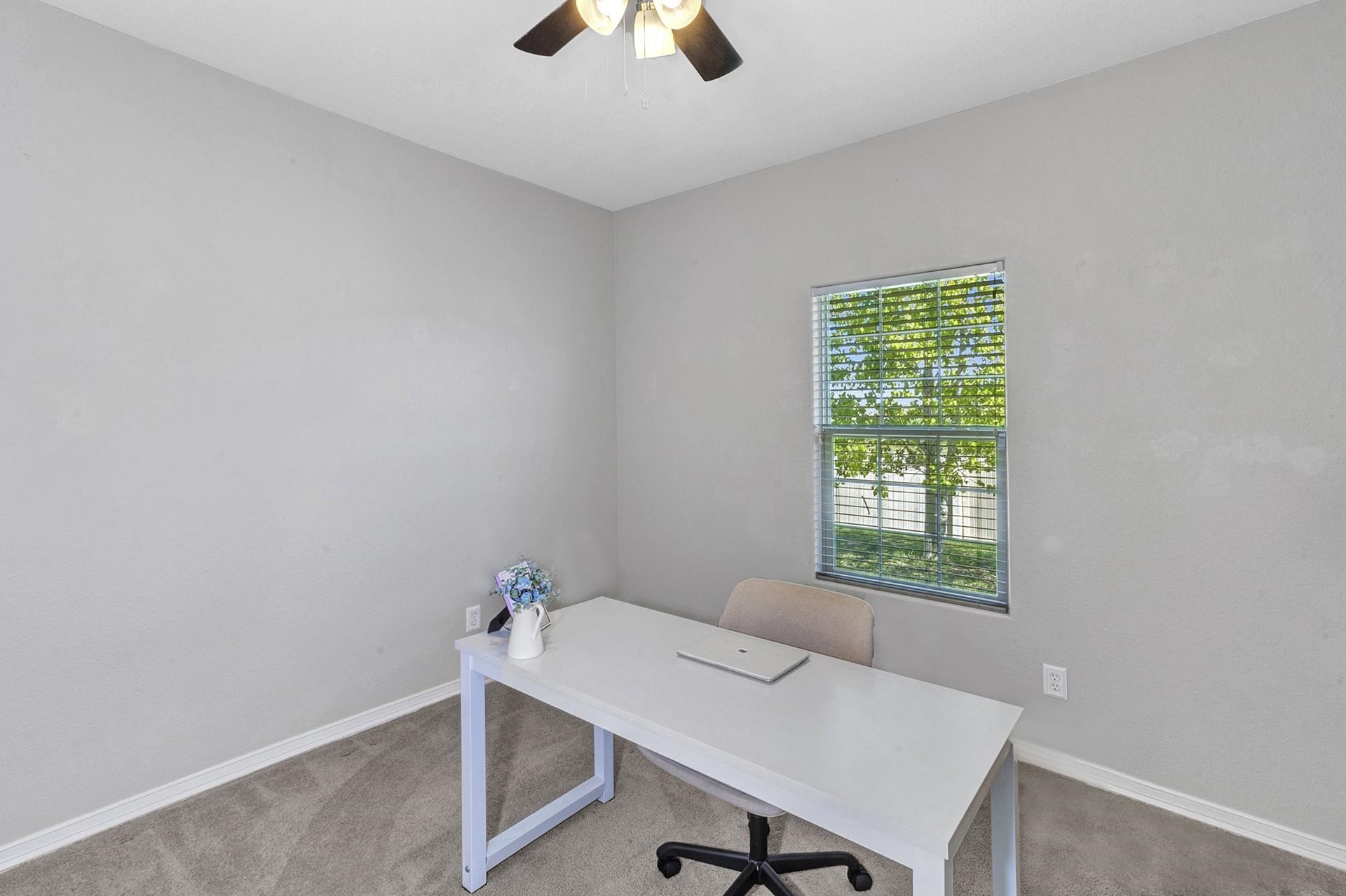 2432 Jack Creek Road Grand Junction, CO 81505 - Photo 16 of 26 a workspace with furniture and a window