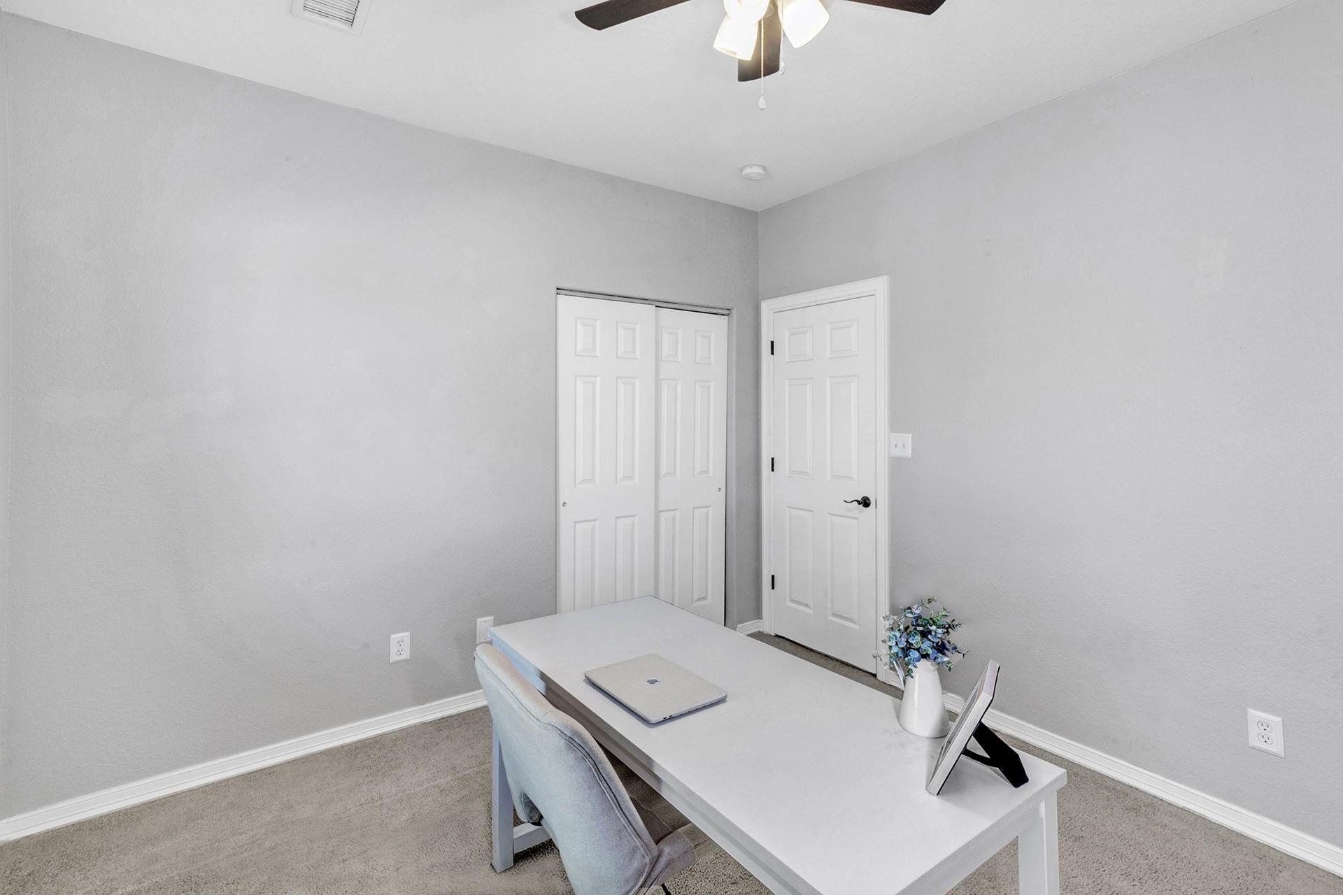 2432 Jack Creek Road Grand Junction, CO 81505 - Photo 17 of 26 a room with a table and chairs