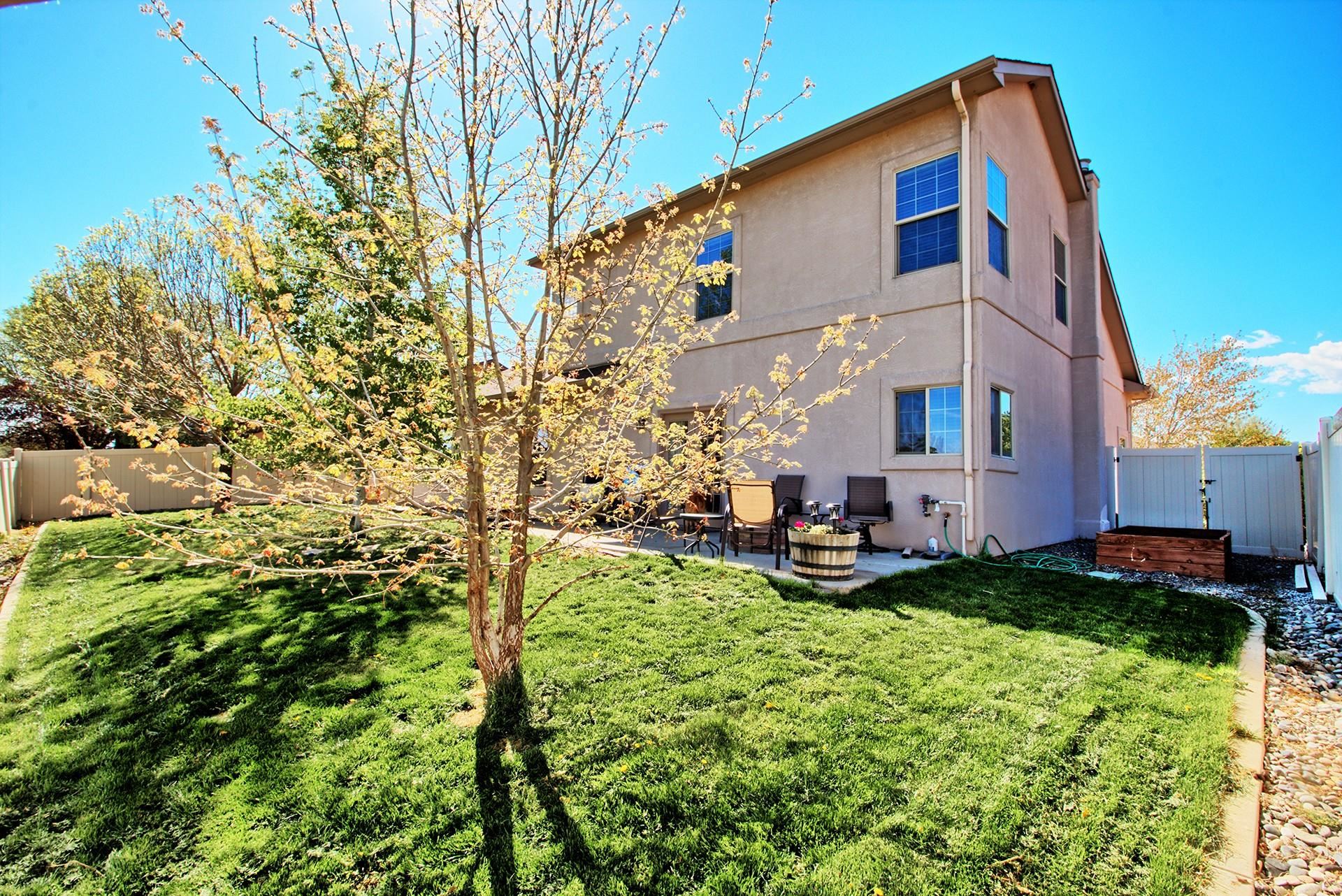 2432 Jack Creek Road Grand Junction, CO 81505 - Photo 24 of 26 a view of a house with a yard and sitting area