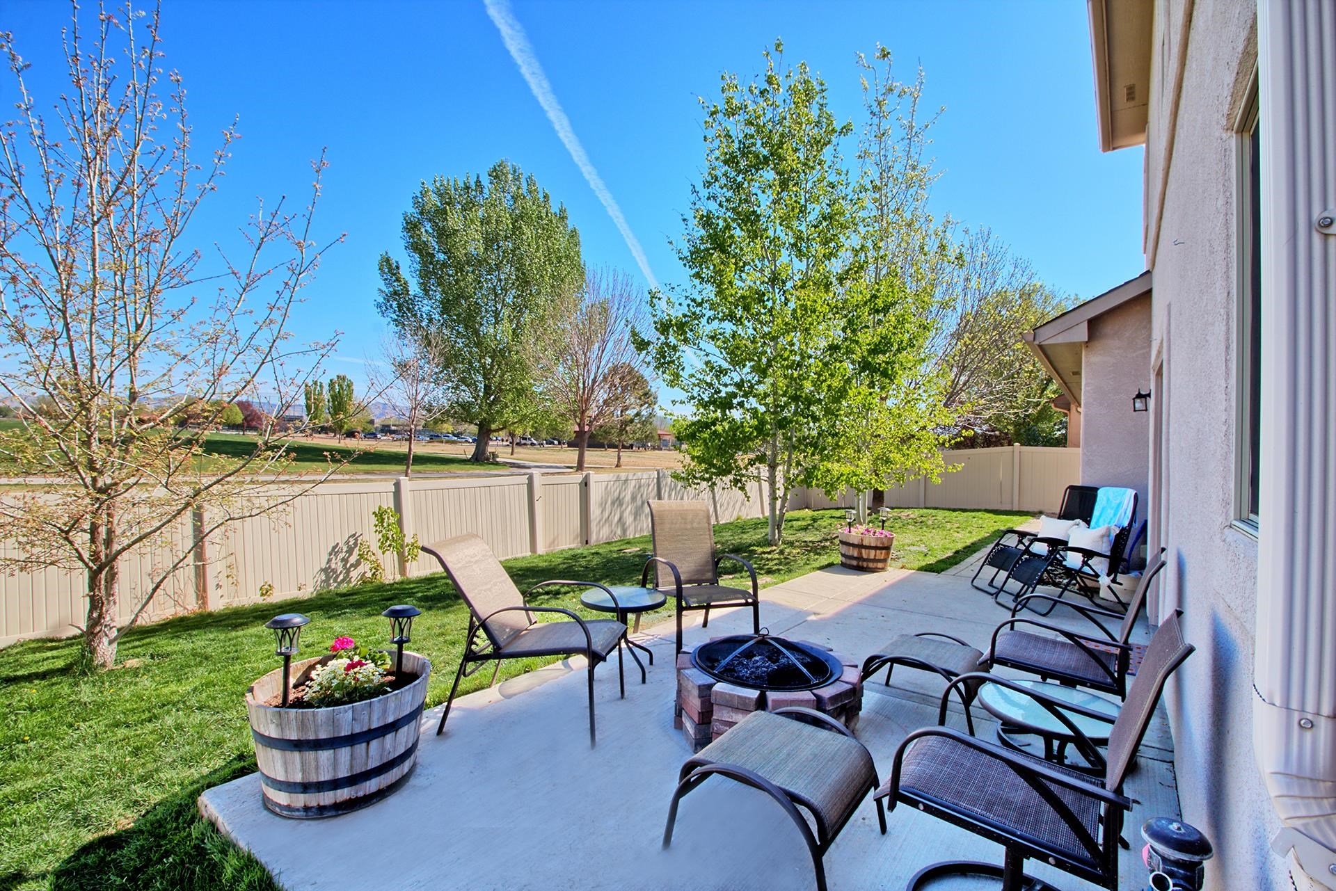 2432 Jack Creek Road Grand Junction, CO 81505 - Photo 26 of 26 a backyard of a house with outdoor seating
