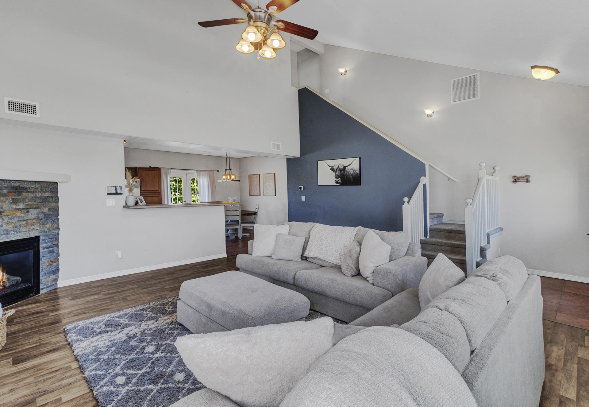 2432 Jack Creek Road Grand Junction, CO 81505 - Photo 7 of 26 a living room with furniture and a wooden floor
