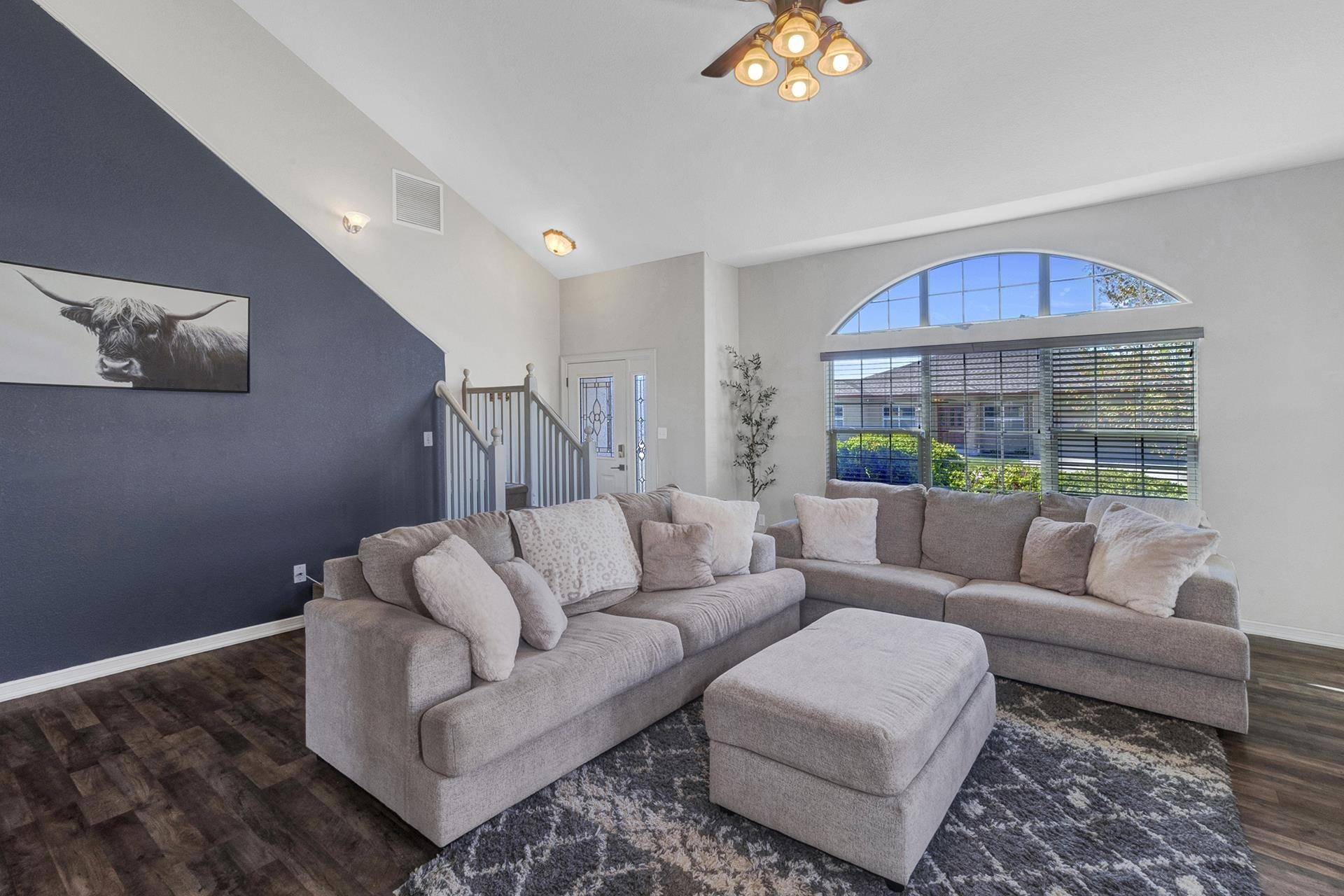 2432 Jack Creek Road Grand Junction, CO 81505 - Photo 8 of 26 a living room with furniture and a large window