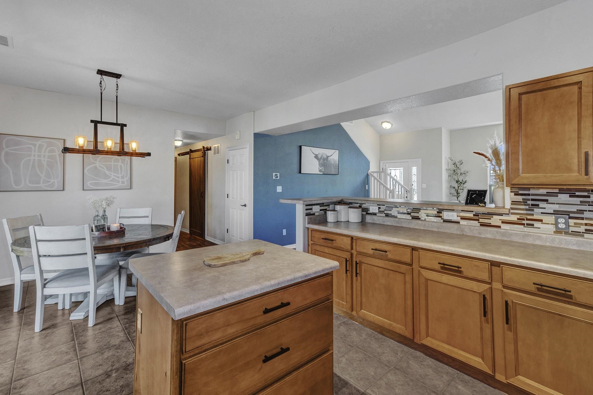 2432 Jack Creek Road Grand Junction, CO 81505 - Photo 10 of 26 a kitchen with a sink cabinets and wooden floor
