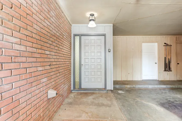 a view of entryway with wooden floor