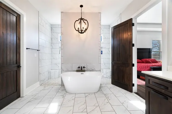 a bathroom with a bathtub and shower