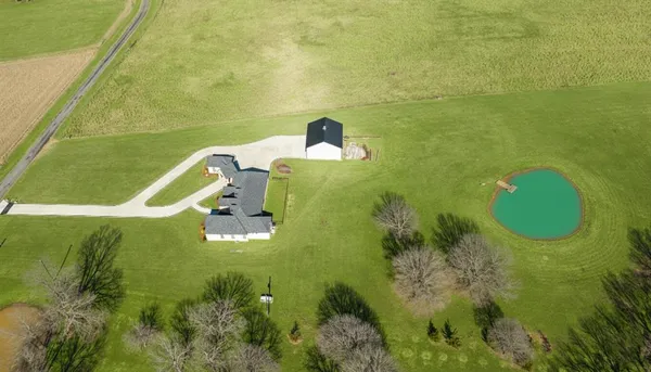 a aerial view of a house with a swimming pool