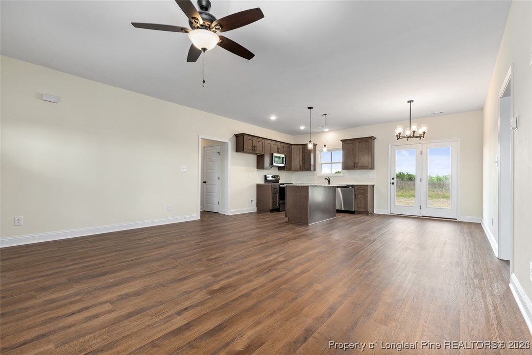 111 Merle Road Pinebluff, NC 28373 - Photo 14 of 32 a view of a kitchen with a sink and a stove top oven