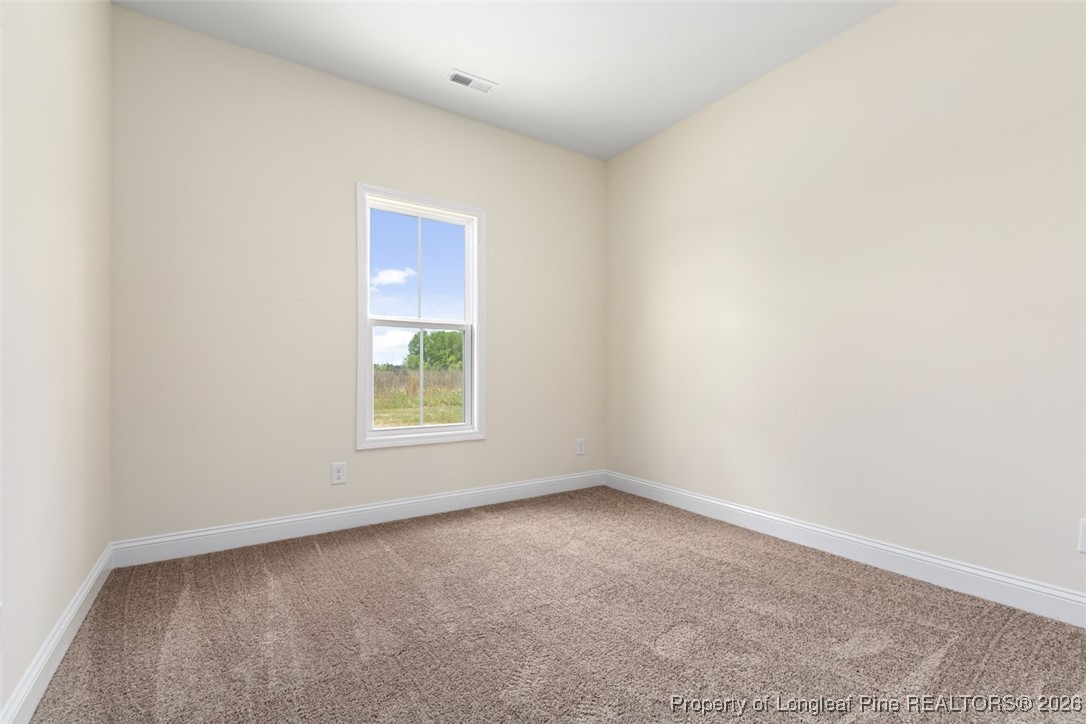 111 Merle Road Pinebluff, NC 28373 - Photo 23 of 32 an empty room with a window