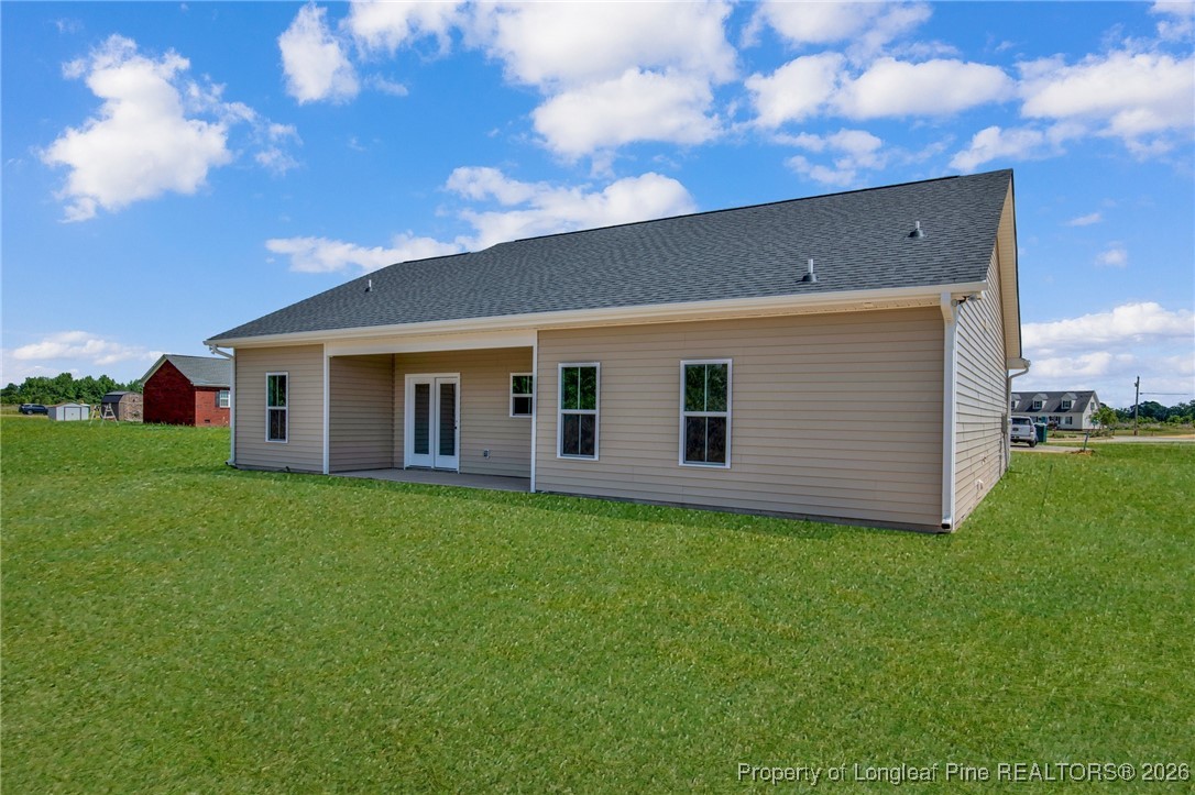 111 Merle Road Pinebluff, NC 28373 - Photo 32 of 32 a backyard of a house with plants and large tree