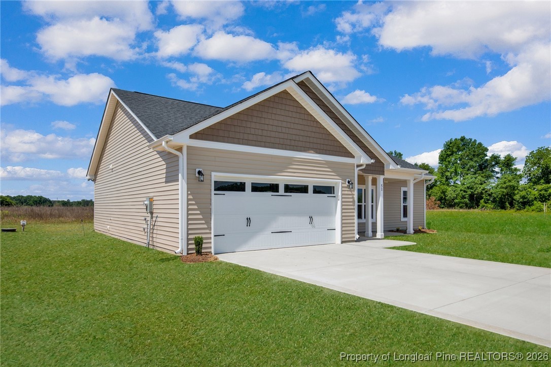 111 Merle Road Pinebluff, NC 28373 - Photo 6 of 32 a view of a house with a yard