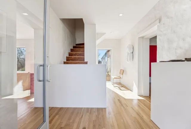 a view of a living room with wooden floor