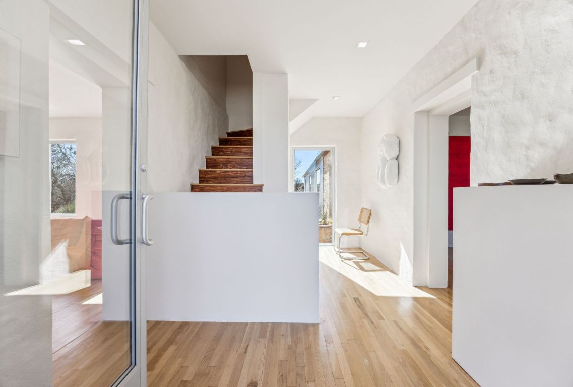 a view of a living room with wooden floor