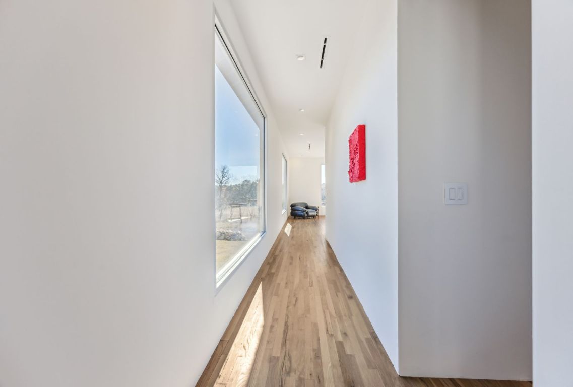 1037 Ranch Road 962 West Round Mountain, TX 78663 - Photo 22 of 40 a view of a hallway with wooden floor and staircase
