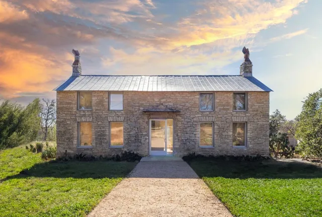 a front view of a house with yard