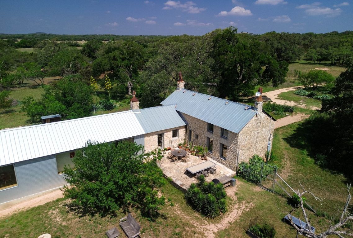 1037 Ranch Road 962 West Round Mountain, TX 78663 - Photo 35 of 40 an aerial view of a house with a garden and a yard