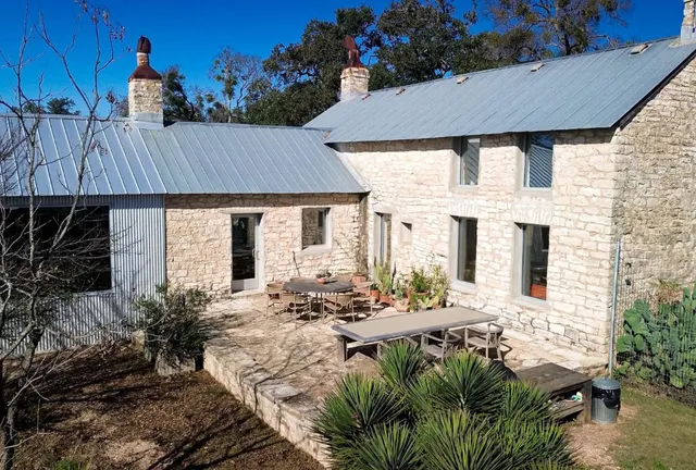 an aerial view of a backyard and yard