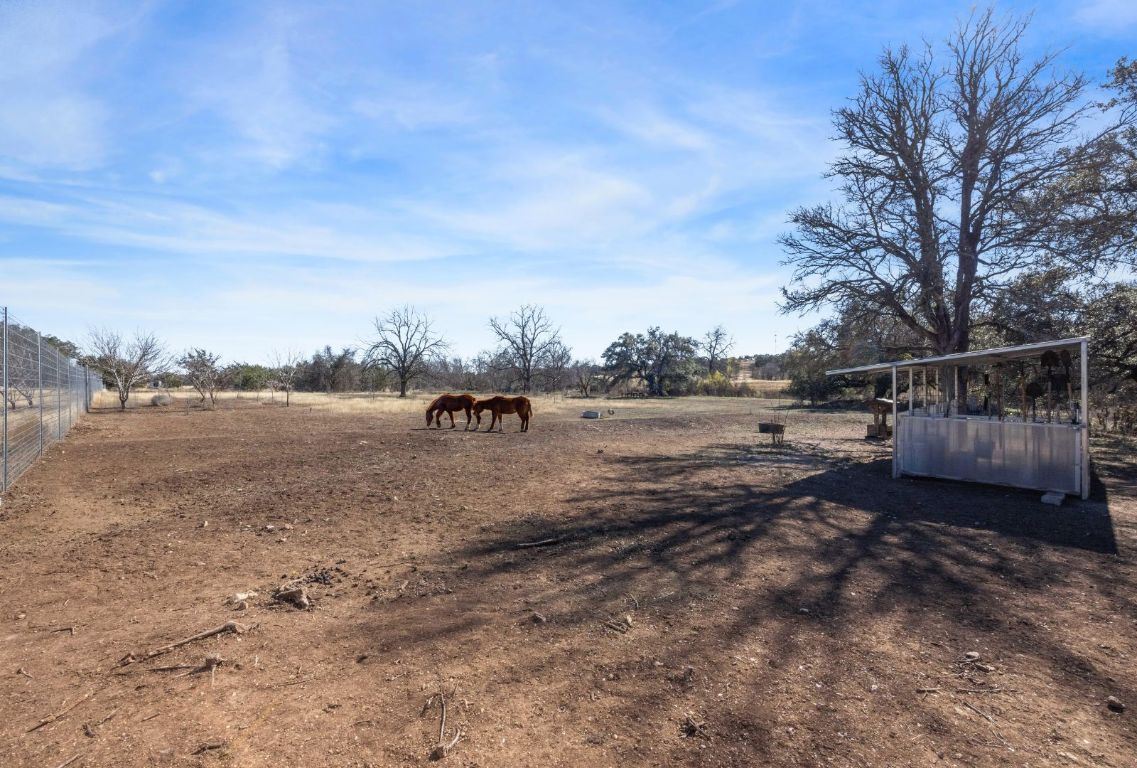 1037 Ranch Road 962 West Round Mountain, TX 78663 - Photo 37 of 40 a view of a yard with wooden fence