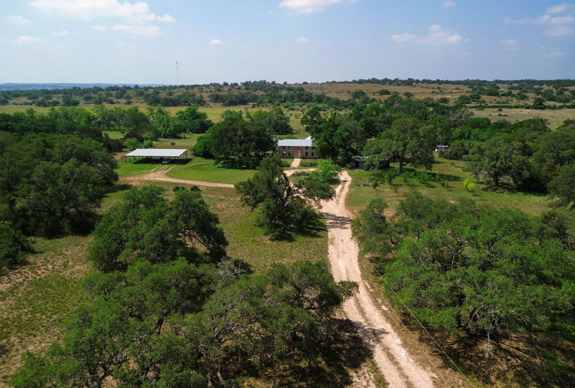 1037 Ranch Road 962 West Round Mountain, TX 78663 - Photo 4 of 40 a view of a lake with large trees