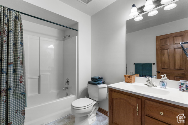 1340 Trapper Loop Garden City, UT 84028 - Photo 27 of 35 Full bath with shower / bath combo with shower curtain, vanity, and tile patterned flooring
