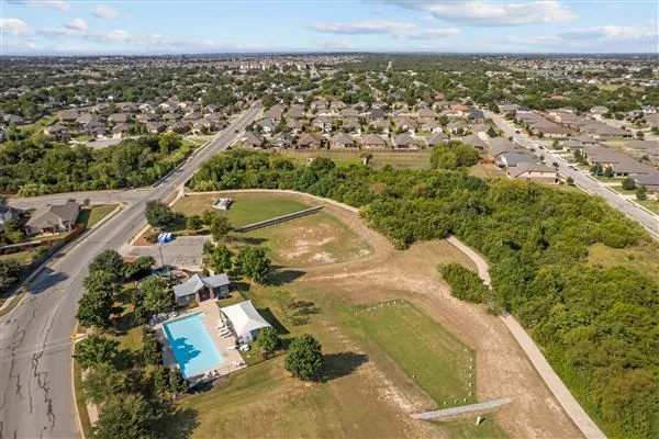 an aerial view of residential house with parking space