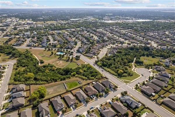 an aerial view of a house with swimming pool