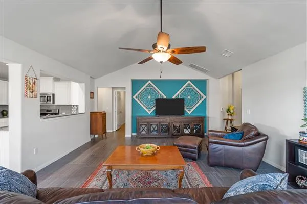 a living room with furniture and a large window