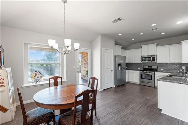 a view of a brick house with a potted plants