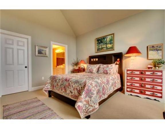 15 D Trail Ridge Way, Unit 52 Harvard, MA 01451 - Photo 13 of 29 a bedroom with a bed and wooden floor