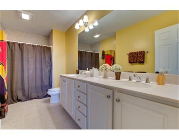 15 D Trail Ridge Way, Unit 52 Harvard, MA 01451 - Photo 14 of 29 a bathroom with a double vanity sink and a mirror