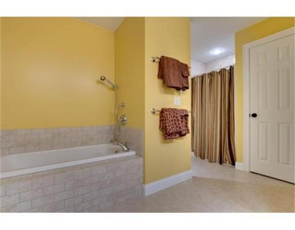 15 D Trail Ridge Way, Unit 52 Harvard, MA 01451 - Photo 17 of 29 a bathroom with a shower and a tub