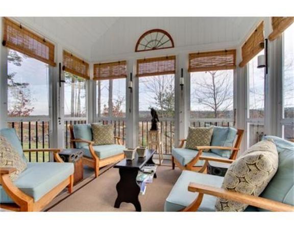 15 D Trail Ridge Way, Unit 52 Harvard, MA 01451 - Photo 22 of 29 a living room with furniture and floor to ceiling windows