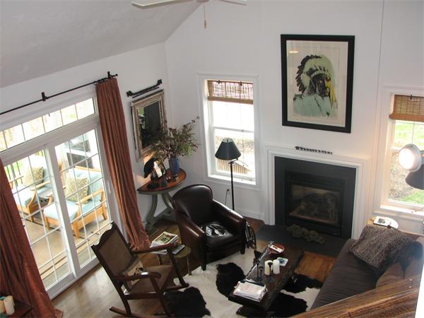 15 D Trail Ridge Way, Unit 52 Harvard, MA 01451 - Photo 24 of 29 a living room with furniture a flat screen tv and a fireplace