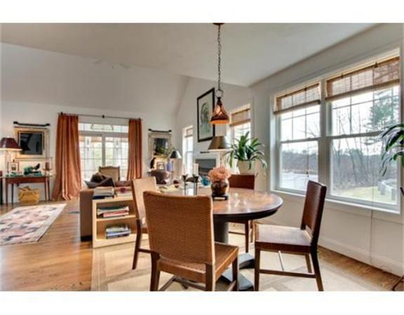 15 D Trail Ridge Way, Unit 52 Harvard, MA 01451 - Photo 6 of 29 a dining room with furniture a chandelier and wooden floor
