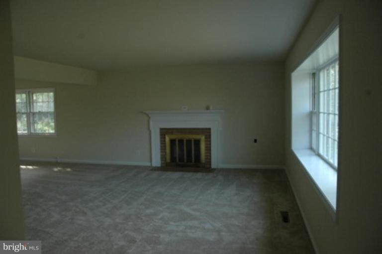 living room with wood burning fire place
