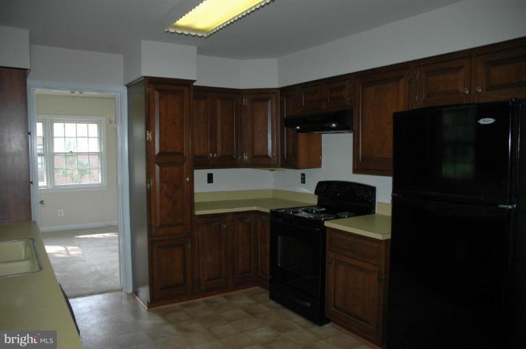 Kitchen with custom cabinets  and new appliances