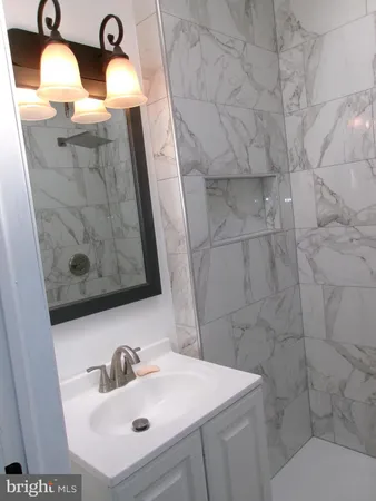 a bathroom with a sink and mirror