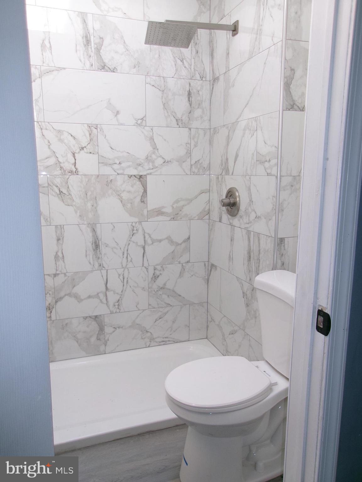 1017 Barker Road Sharon Hill, PA 19079 - Photo 13 of 20 a bathroom with a toilet and a shower
