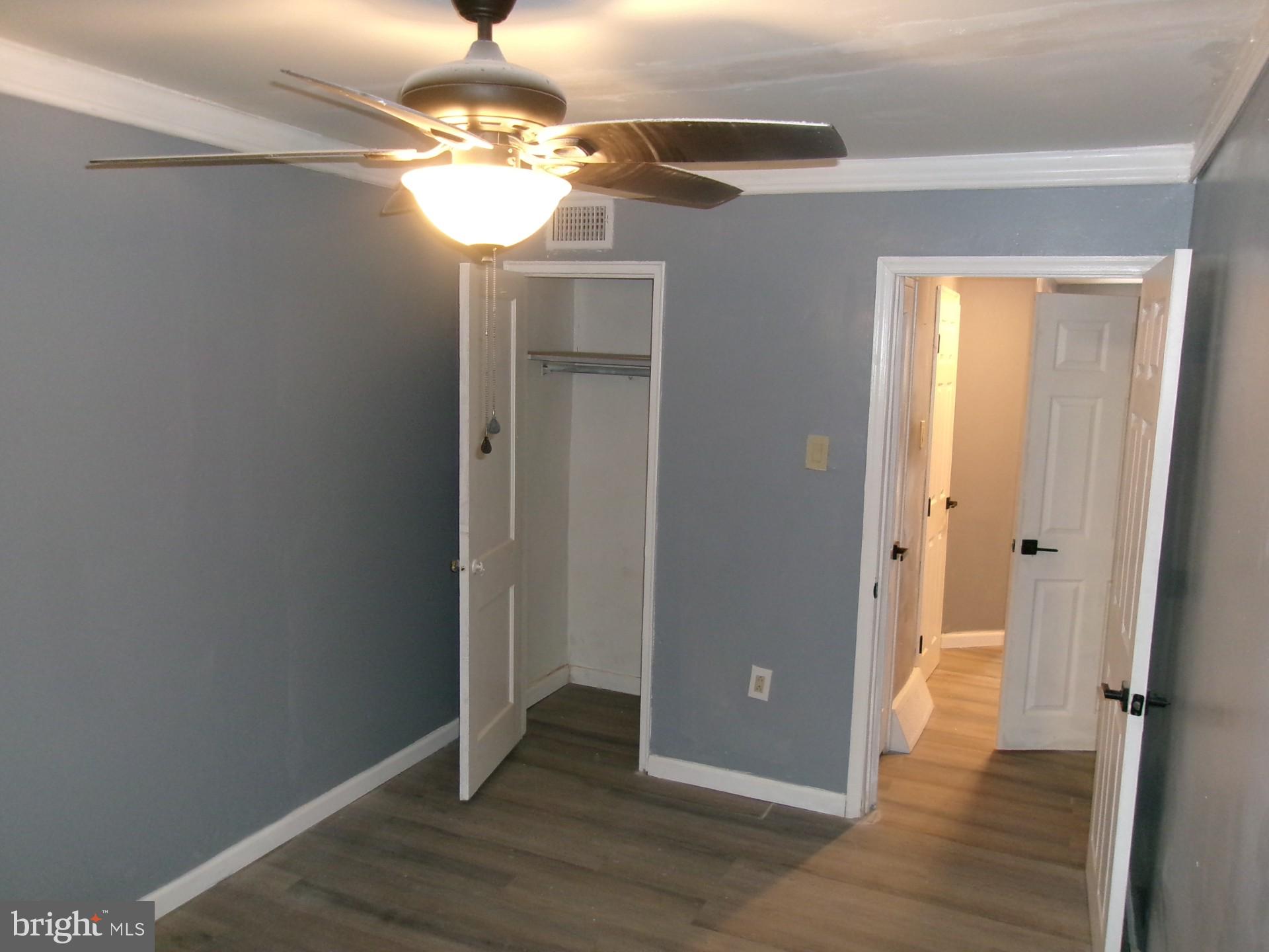 1017 Barker Road Sharon Hill, PA 19079 - Photo 8 of 20 wooden floor in an empty room with a mirror