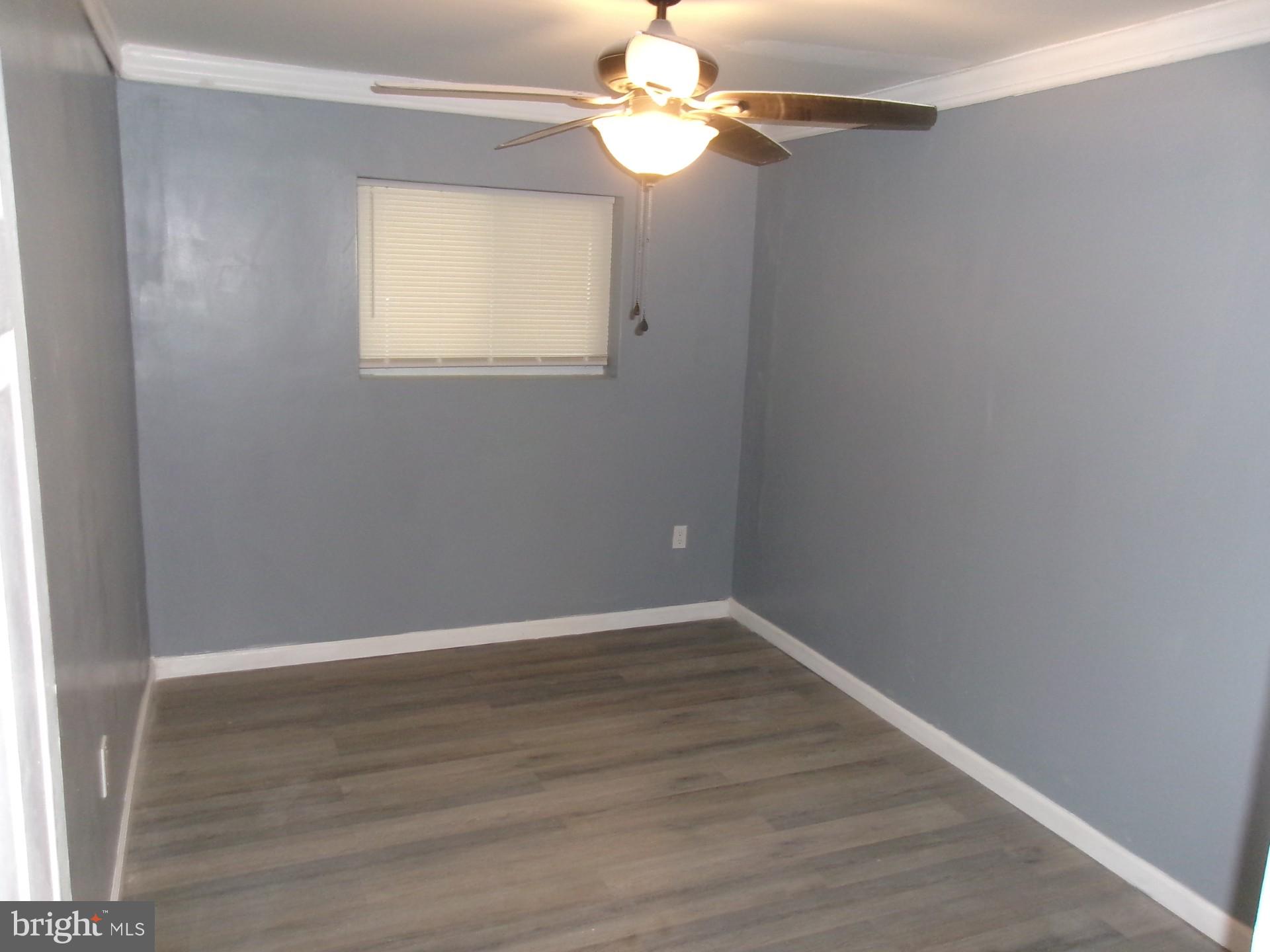 1017 Barker Road Sharon Hill, PA 19079 - Photo 9 of 20 wooden floor in an empty room with a window