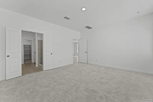 a bathroom with a double vanity sink and mirror