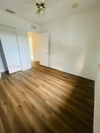 a view of a park with large trees