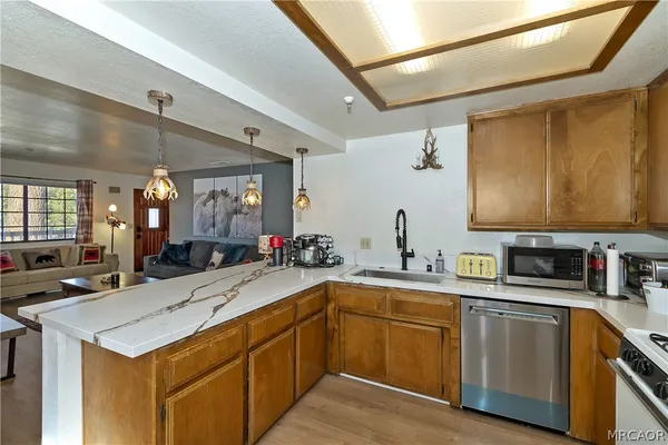 a kitchen with a sink stove and cabinets