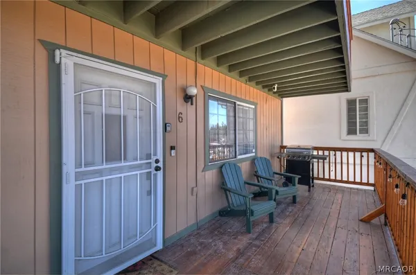a view of outdoor space with wooden floor and furniture