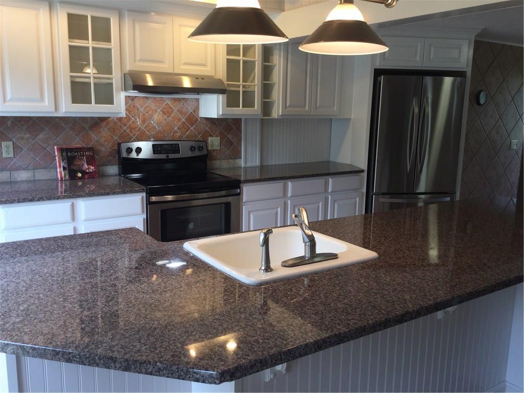 296 Beedle Road Richmond, ME 04357 - Photo 18 of 34 Tile backsplash and raised panel...