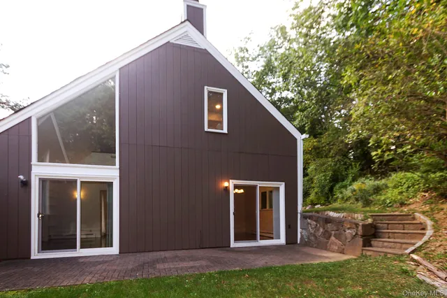 a view of a pathway both side of house